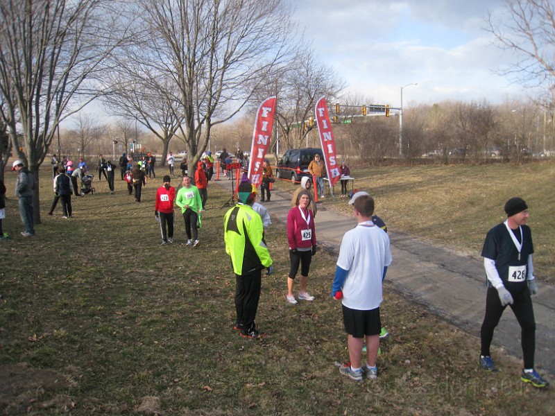 2013 Twinkie 5K 50.JPG - The 2013 Twinkie 5K. This is run on April Fools Day (April 1) every year. It is run in Ann Arbors Gallup Park. This year was a very cold and windy evening. (It is run at 6:15 pm)